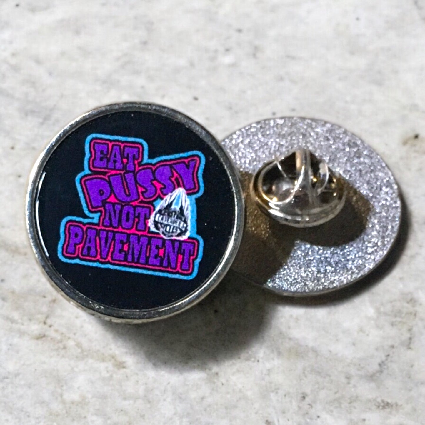 Vest pin with “eat pussy not pavement” (purple)